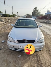 اوبل استرا • ٢٠٠٢ • انكليزي باسمي