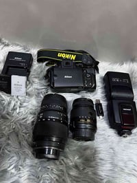 نيكون D5100 • عدسات 18-55/70-300 • فلاش بطاريتين