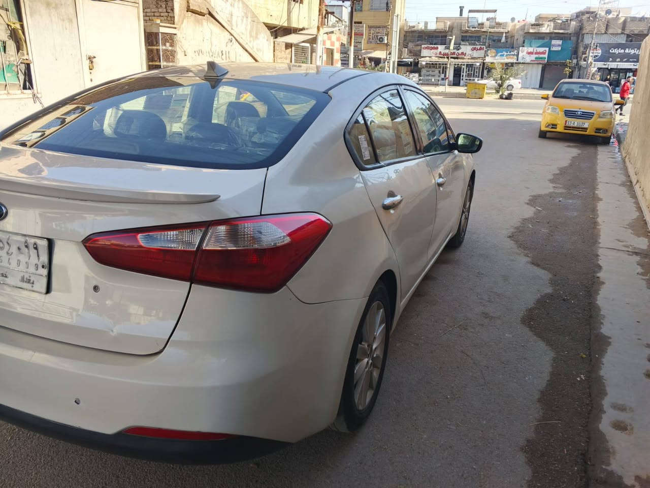 كيا فورتي موديل 2015 رقم بغداد مشروع الوطني تحويل ثاني ملاحظه السياره جاهزه من كل شيء تخم تاير تبريد شغال حجم المحرك 1800 دوش سياره وارد امريكي  السعر 97 وبيها مجال مكان السياره بغداد رقم الهاتف ***********
