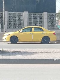 كورلا 2009 وارد أمريكي محدثة ال13 هيئه مصفره جاهزه من كولشي السعر 90 و...