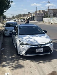 كورلا هايبرد  2025 فول موصفات بصمه فتحة  جلد داخل احمر كشن كهرباء سباي...