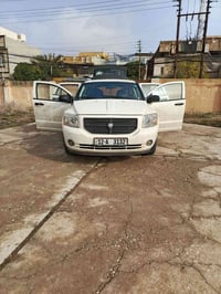 للبيع دوج كاليبر 2008 رقم جديد كربون بانزين مصبوغه عام جماليه السعر 60...