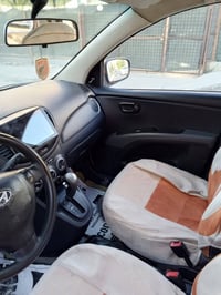 هونداي i10 موديل 2015 لون مميز رقم بغداد دولي سابقا كان بيها جراد بسيط...