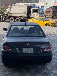 لانسر ٢٠٠٩ خليجي السيارة مكفولة من كلشي عدة رصعات قليلة وجاملغ جهة الس...