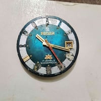 ساعة ريكو • حركة يدوية • عرض اليوم والتاريخ