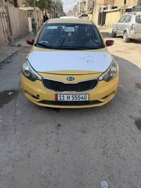 عندي كيا فورتي للبيع موديل 2015 رقم بغداد مشروع وطني رقم جديد تحويل مي...
