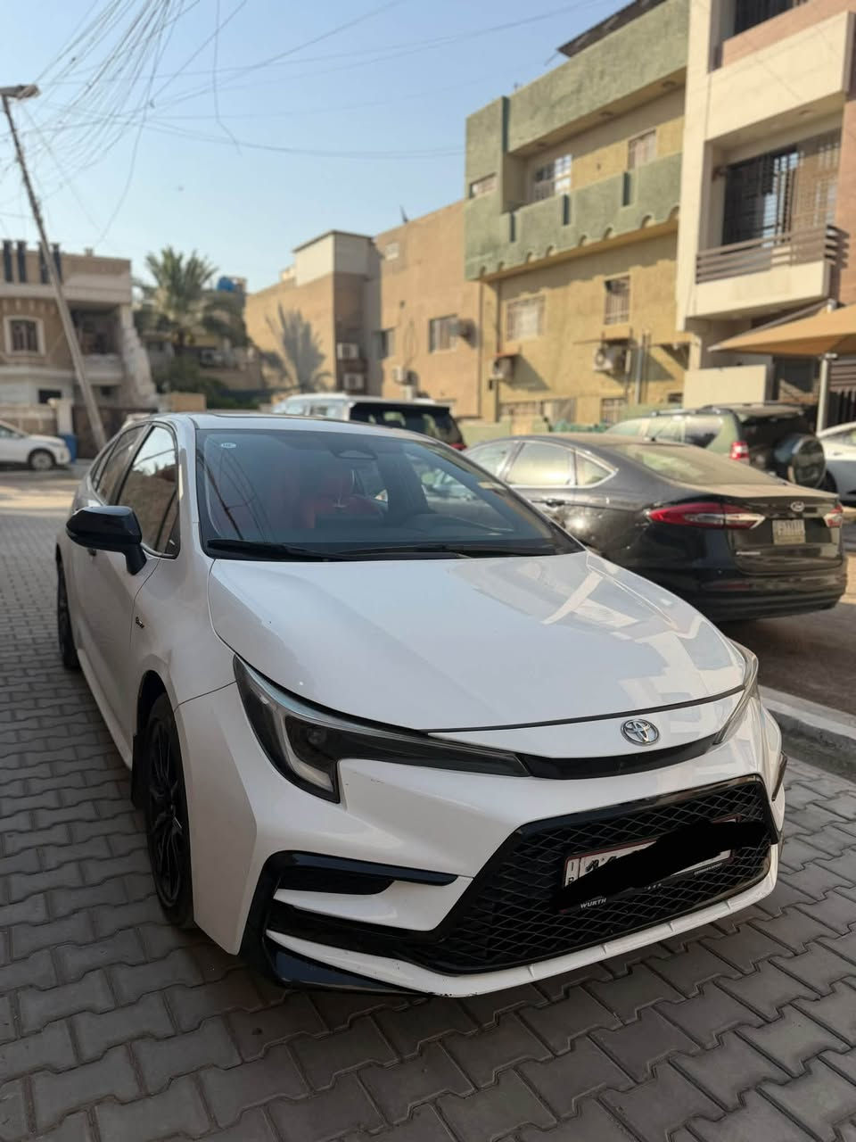 السلام عليكم للبيع تويوتا كورلا 2025 شكل الامريكي S بلاك ادشن اصل رقم بغداد بأسمي تحويل ثاني يوم السيارة ماشية 12 الف فول مواصفات 1/1 بصمة ابواب وترحيب + سلايت + تحكمات مري + تحكمات ستيرن جهتين + اوتو هولد + درايڤ مود ايكو  و بور + شاشة دجتل + كروس سرعة + تحديد مسار + سياقة الية + رادار امامي + لايت LED + بك لايت LED + كامرة خلفية + ويل اسود بلادي + مري اسود بلادي وباقي المواصفات المعروفة بلفول . 
السيارة بيه البنيد مصبوغ فقط + ملاحضات بسيطة . 
السعر : 147$ .
مكانه : بغداد شارع فلسطين . 
للأستفسار : ***********
