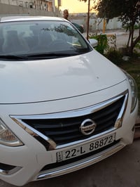 سني موديل ٢٤ للبيع ابيض رقم اربيل بدون حادث فقط دجة الباب أسفلها بالصو...