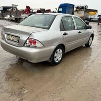 لانسر ٢٠٠٩ • اوتوماتيك • طواير جديدة