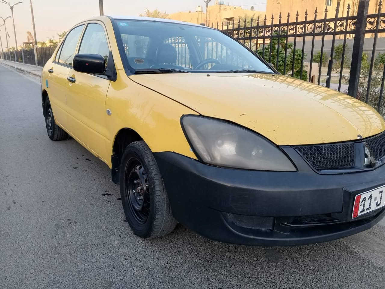 السلام عليكم لانسر الشركة العامة 
موديل ١٠  رقم انكليزي ما بيها ضربه السياره مصفرة هيئة وغرامات مكانه بغداد زعفرانيه *********** واتساب السعر ٦٣
