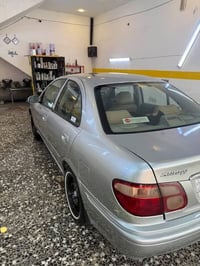 نيسان سني للبيع صبغ عام محرك 1600 كير عادي نقص كمبريسر سنويه لحد27 سيا...