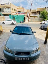 كامري موديل 2001 وارد امريكي   رقم بغداد انكليزي بأسمي السياره   مصبوغ...