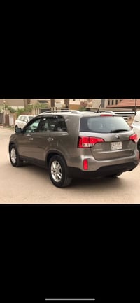 سورنتو 2014  وارد امريكي  مكينه 2400  رقم بغداد  مواصفاتها بردات خلفيه...