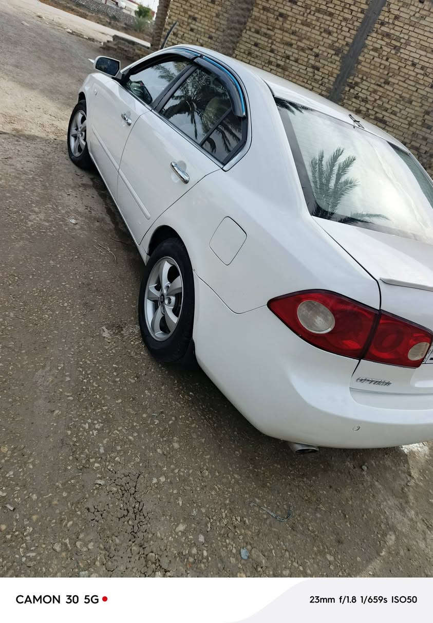 كيا اوبتيما 2008مصبوغ حزام وارد امريكي جير مكينه كفاله حداديه تخنتاير باسمي مداورم ثاني يوم السعر 98 وبيها مجال حق الجيه رقم بغداد بسمي دولي*********** المكان بابل الدبله
