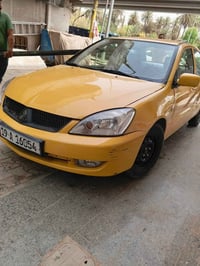 لانسر موديل 2012 رقم كربلاء  سنوية ب اسمي تحويل بنفس اليوم سيارة جاهزة...