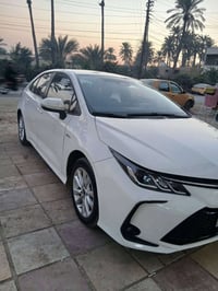 كورولا هايبرد موديل 25 رقم بغداد  تحويل مباشر باسمي بيها صبغ اربع قطع ...