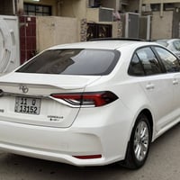 كورلا هايبرد 2024 ماشيه 14 الف  مكفوله بيه رصعه بالباب فقط رقم بغداد ب...