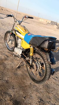 دراجة نارية • أبيض • القرنه