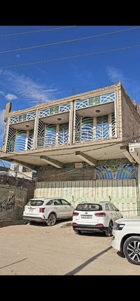 بناية • ركن واجهة ١٠٠م • تقاطع عبدالكريم قاسم