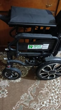 كرسي متحرك • جديد • مع كارتون