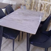 ميز طعام 4 كراسي مرمر الكراسي جلد والارجل حديد مالته ممتواجد على الفيس...