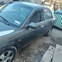 سيارة سبكترا 2003 مكفوله من كلشي كير محرك خير من الله رقم بغداد/078404...