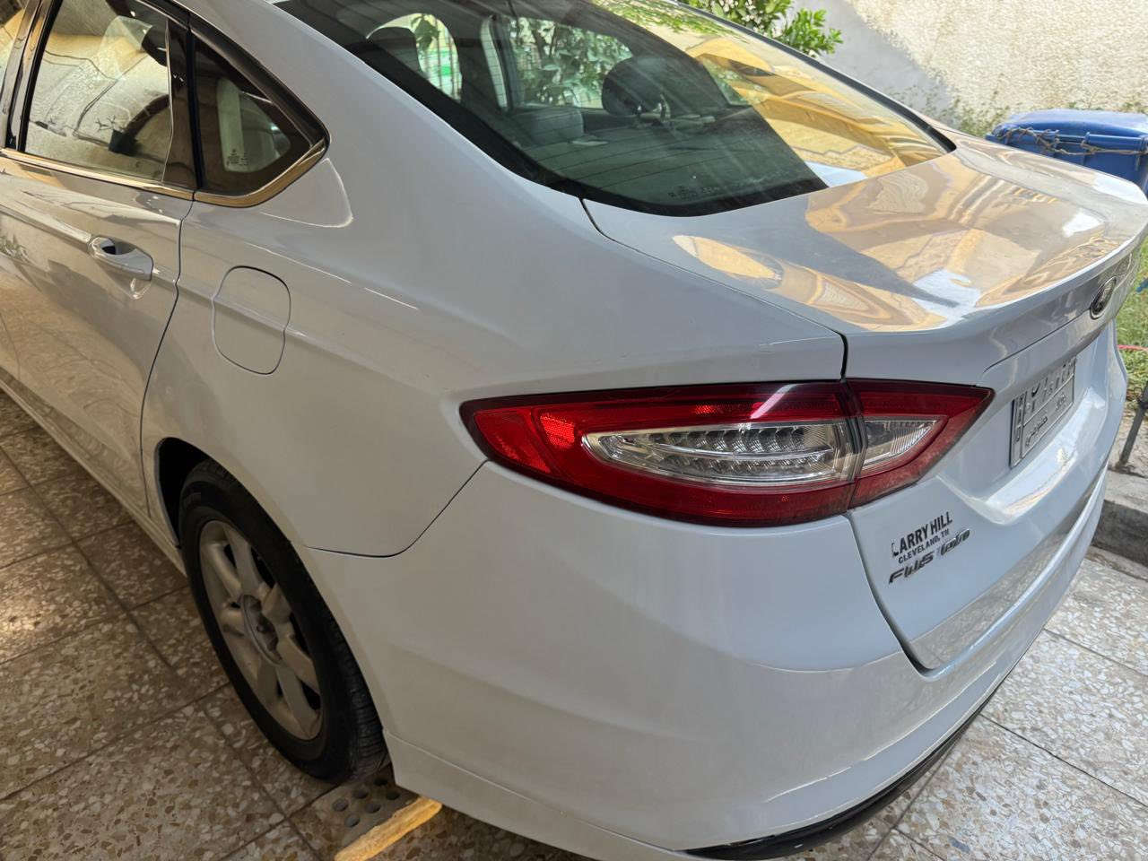 فورد فيوجن موديل 2013  محرك 2500 تنفس طبيعي اللون ابيض بغداد الصور المرفقة نظافة السيارة جيدة الحادث الأصلي دعامية جهة المعاكسة للسائق ومبدل الدعامية مع صبغ طرف البنيد وأجزاء اخرى نتيجة شخطات الشواصي واللغود سليمة السيارة موجدة ببغداد للتواصل (***********) اتصال فقط واتساب او رقم ، السعر 95 ورقة بيها مجال بسيط
