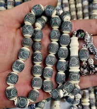 عاج • الياقوت الأحمر • فضة 999