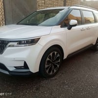 للبيع او مراوس بسيارة أقل سعر كيا كرنفال موديل 2023 ابيض صدفي رقم بغدا...