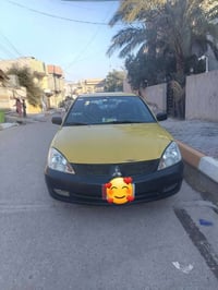 لانسر ٢٠١٠ • اوتوماتيك • رقم بغداد