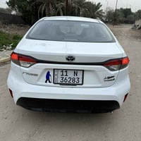 كورلا هايبرد 2023 شكل الامريكي  فتحة بصمه ماشيه18الف شاشة كامرة  راادا...