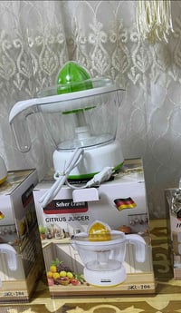 عصارة برتقال • كهربائية • توصيل