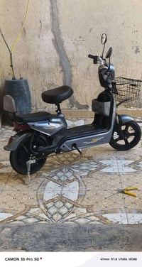 دراجه شحن حجم ١٤ جديده استعمال اسبوعين بصمتين دراجه بل كارتون  ٤بطاريا...