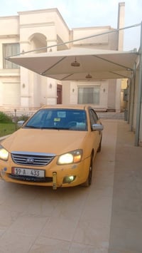 كيا سبكترا للبيع سياره باسمي مكينه كير حداديه تبريد سياره مصفره 078075...