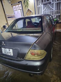 للبيع  لانسر مسيوبشي 2001 شكل 2011 كويتي كير مكفول محرك بي تبخير وتنقي...