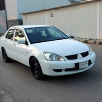 للبيع لانسر 2011 شركه عامه مكفوله من الصبغ حتى الدعاميات محرك 1600 كير...