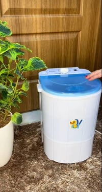 هزاز كهربائي • غسالة طفل