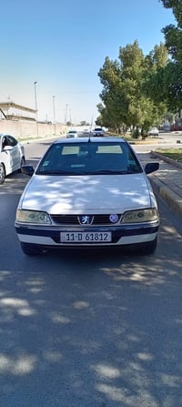 للبيع بيجو 405 موديل ٢٠١١ خصوصي ابيض رقم بغداد انكليزي بسمي شخصيأ مصفر...