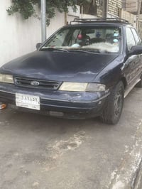 كيا سيفيا موديل1994 قير عادي اللون اسود كحلي بيها مشاكل بسيطة بالنوزلا...