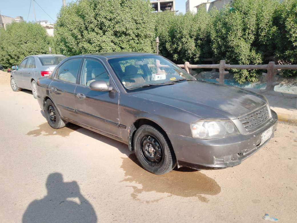 كيا اوبتيما موديل 2001 بغداد سنويه نافذه مكفوله ضربه كص جارده  بلاد السعر 45 وبيه مجال عنوان قلعة سكر تليفون *********** الرفاعي, ذي قار
