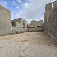 قطعة أرض للبيع 100 متر من القطعة فقط حي الزهراء على شارع عام 20 متر وم...