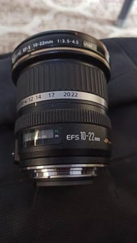 عدسة كانون • 10-22مم • مراوس نيكون