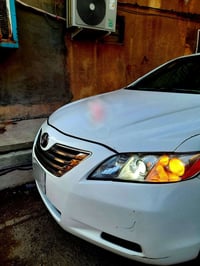 اسلام عليكم كامري موديل 2009 لون ابيض رقم بغداد حادثه جاملغ أمامي او ب...