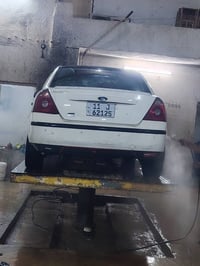 قصد او نقد فورد مونديو ٢٠٠٦ اللون ابيض رقم بغداد انكليزي كير محرك تبري...
