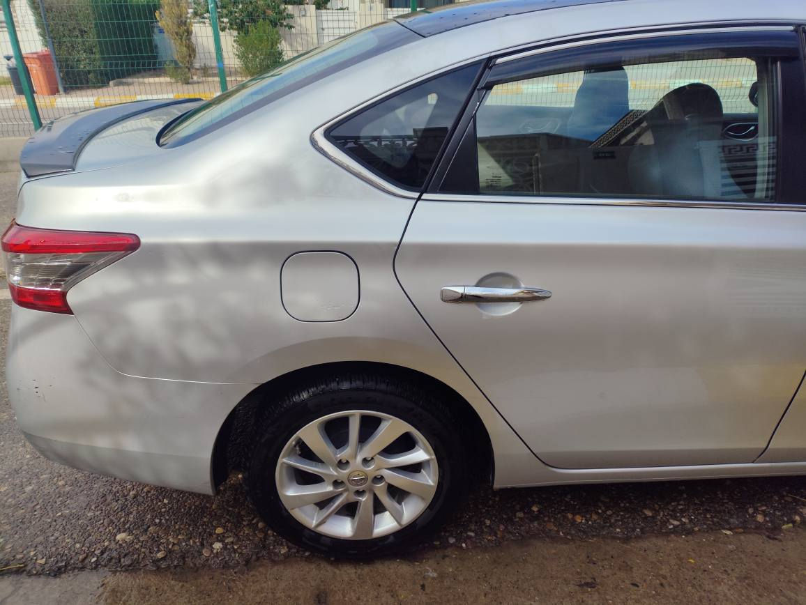 للبيع: نيسان سنترا 2014 SL (فول مواصفات) 💎
لعشاق النظافة والمواصفات الخليجية الكاملة، السيارة بحالة ممتازة وجاهزة للاستخدام.
✅ أهم المميزات:
الموديل: 2014 - فئة SL (أعلى فئة).
المحرك: 1800 CC (المحرك الكبير المرغوب) نشاط واقتصادية عالية.
الوارد: خليجي.
اللون والبدن: كليين (بدون صبغ)،فقط كم مكان بيها جراد
المسافة المقطوعة: 123,000 كيلومتر فقط (ممشى حقيقي).
✨ المواصفات :
بصمة: تشغيل وأبواب.
الشاشة: شاشة كببرة أصلية مع كاميرا خلفية.
التصميم الخارجي: ويل كب بلادي مميز، بلاجكتور (كشافات) بلادي.
الداخلية: مقاعد مريحة، تبريد ثلج، تحكم ستيرن.
ملاحظة: السيارة مسرفسة بالكامل ولا تحتاج لأي مصاريف، إطارات بحالة ممتازة ومحرك وكير بشرط الفحص.
📍 الموقع: [كركوك]
💰 السعر:108 أو "للاستفسار يرجى الاتصال"]
📞 للتواصل والاستفسار: [*********** كركوك, العراق
