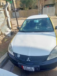 لانسر2009 للبيع محرك كير خير من الله  محرك 2000 رقم انكليزي  تحويل ثان...