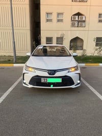 كورلا هايبرد 21 كفاله عامه  ماشية 57 الف  رقم بغداد  07732377187