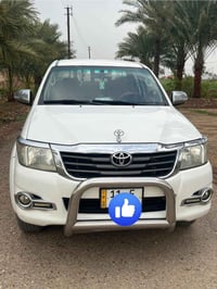 هايلوكس 2014 فورويل مكفولة من كلشي رقم بغداد  بيها طخة بالبك لات مصلحة...