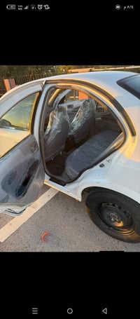 نيسان سني 2001 ياباني رقم بغداد الماني كير عادي محرك محرك 1600اسود الم...