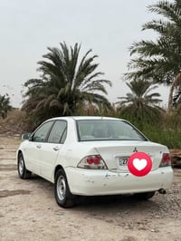 لانسر 2007 مكينة2000 گير ومكينة مكفولات   السيارة مصبوغة عام للجمالية ...